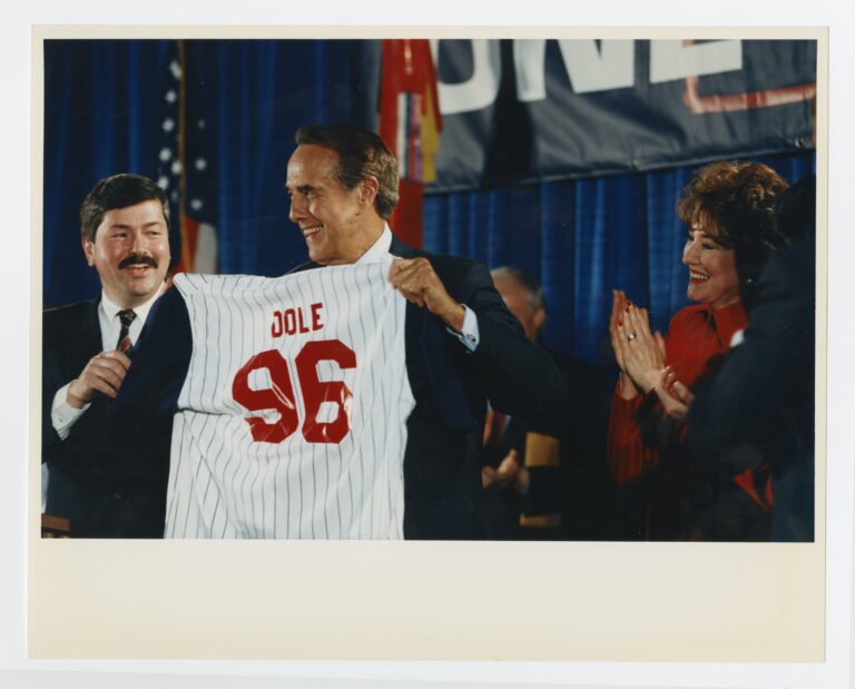 Dole holding up jersey